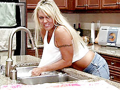 Stunning cougar soaks herself on the kitchen counter and rubs her juicy pink